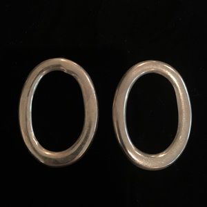 Sterling silver oval pierced earrings.